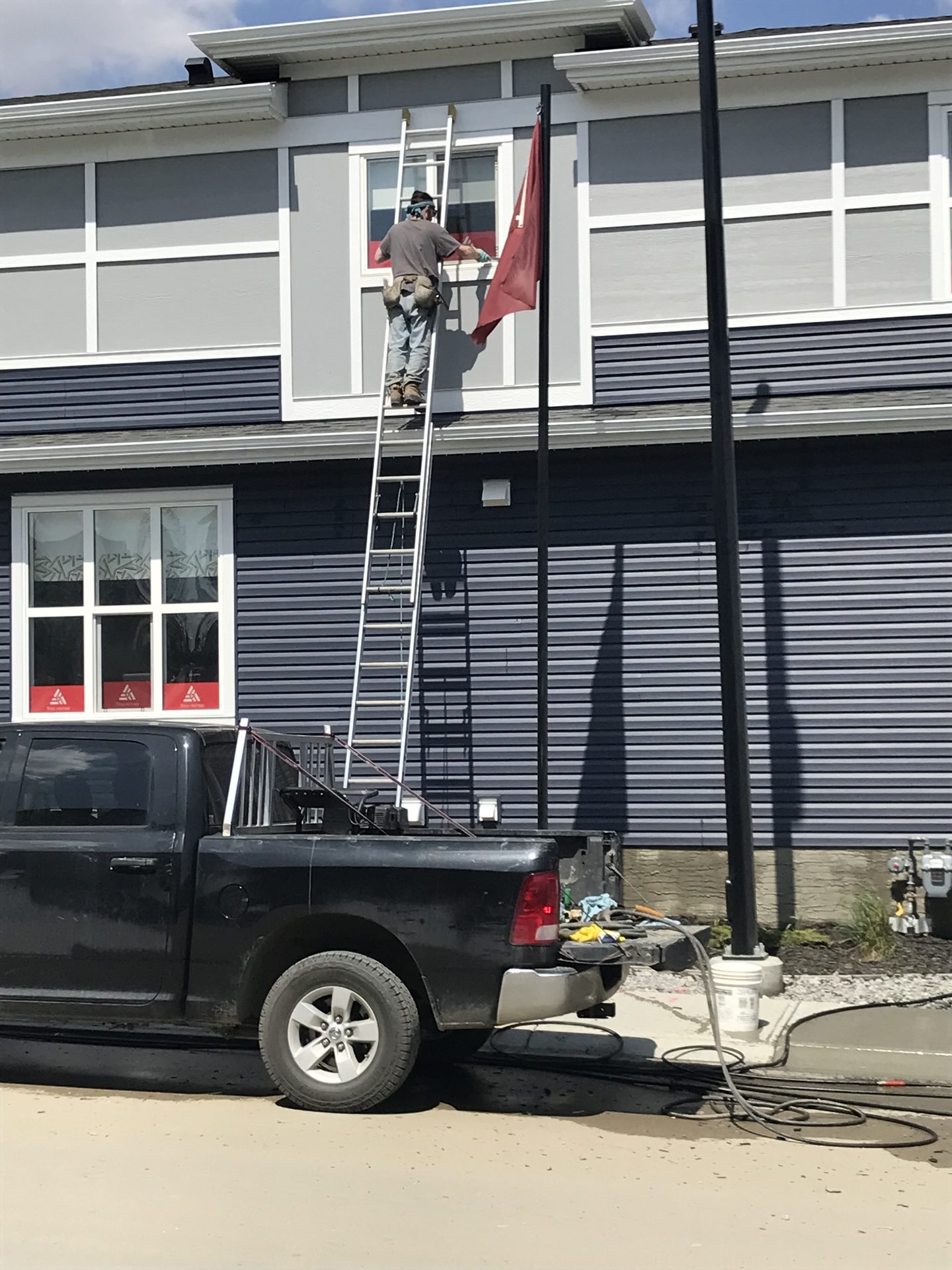 The Squeegee Guys at a commercial window cleaning job in Calgary